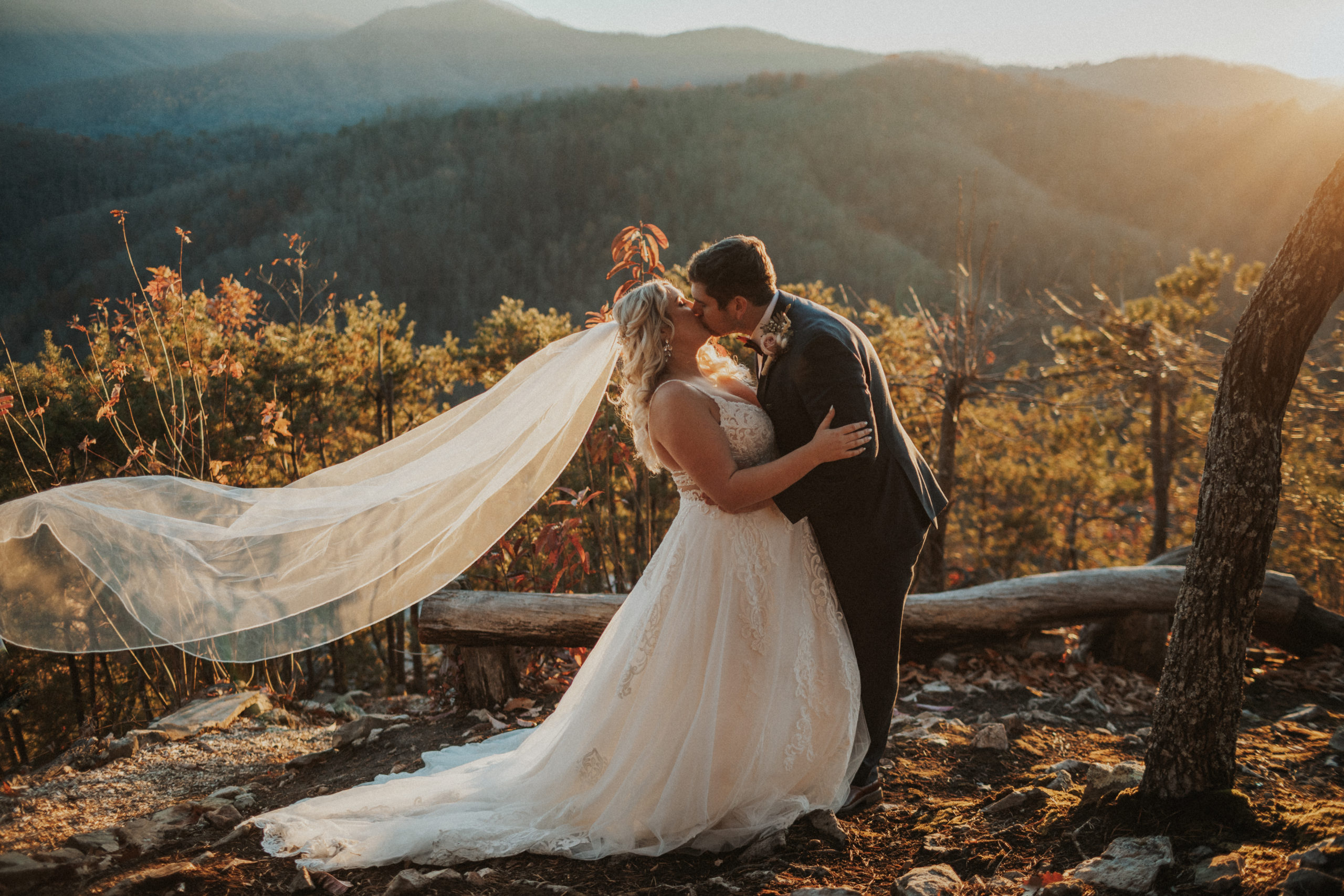 Bride & Groom Kissing in front of the sunset