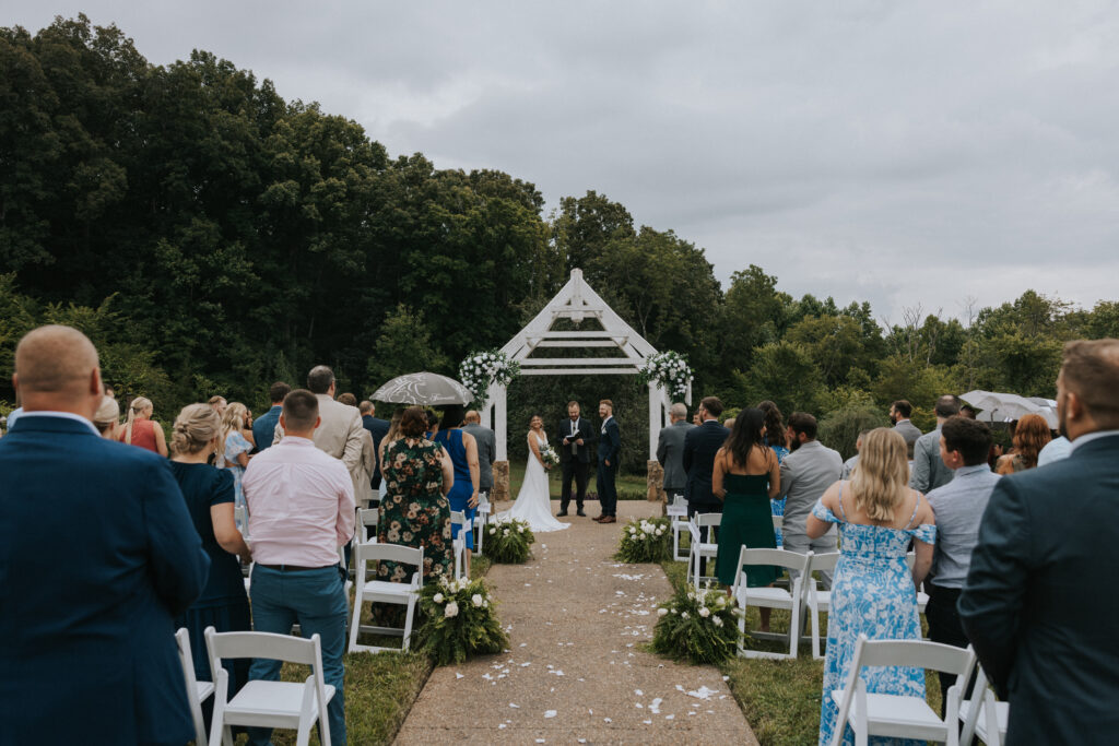 Bride and Groom at the alter during a rainy day 