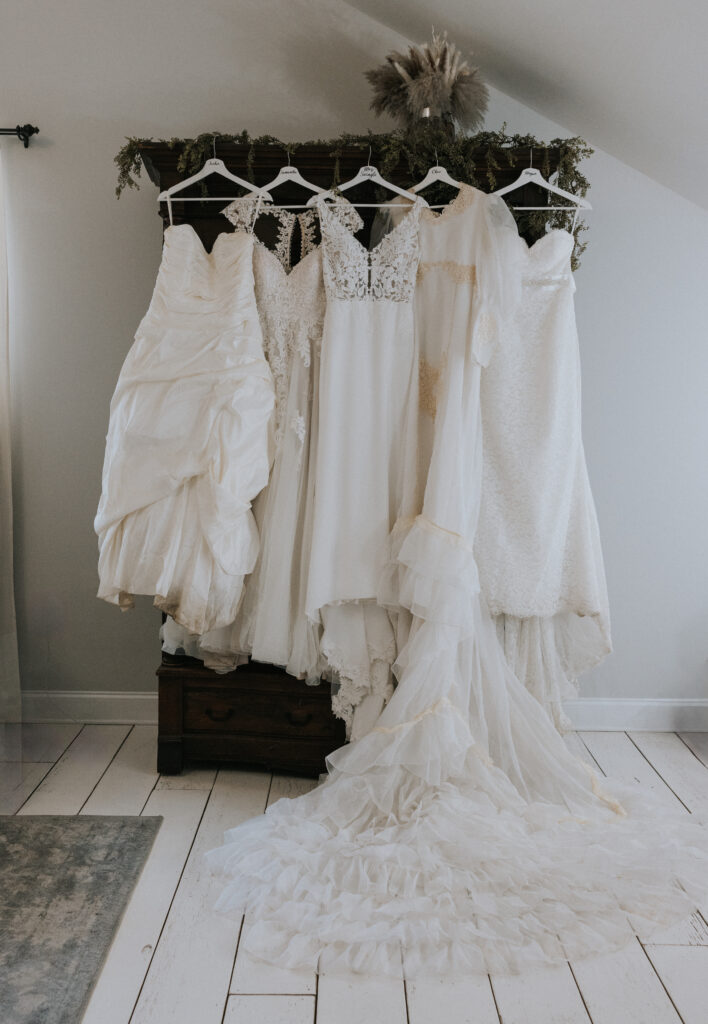 Generations of wedding dresses hanging in the bridal suite