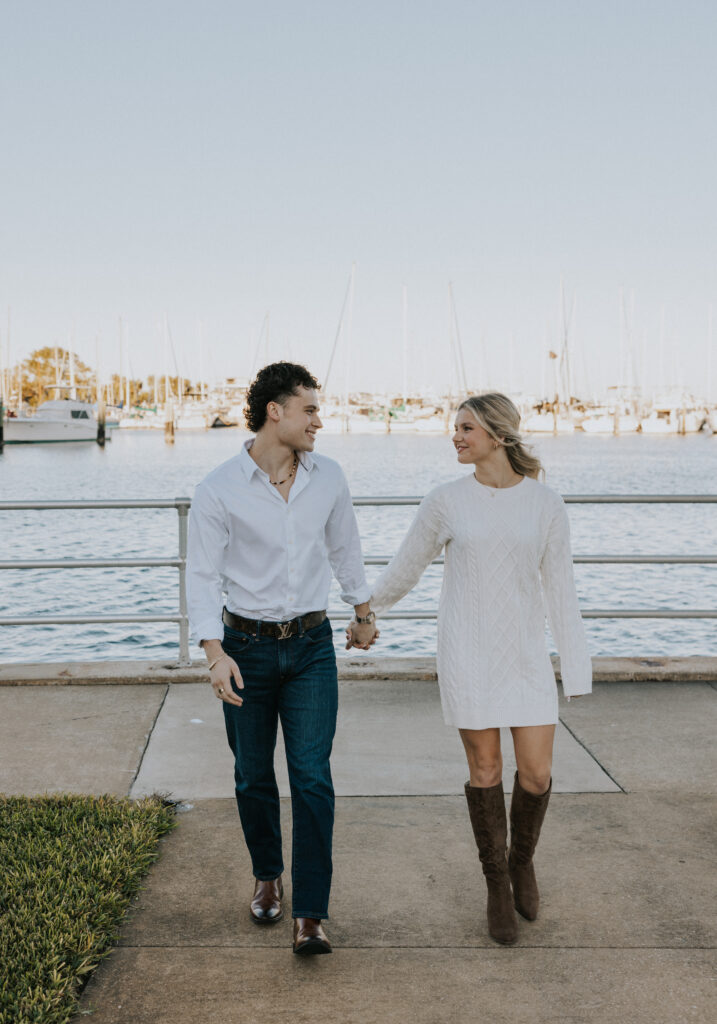 Couple holding hands in St. Pete, FL