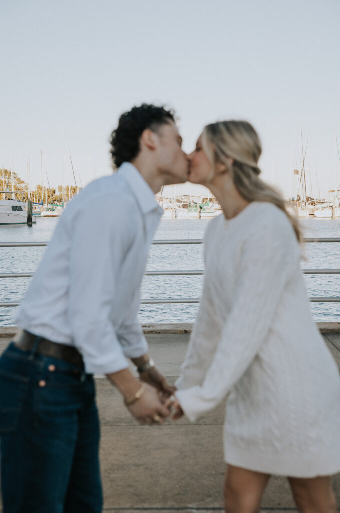 couple taking photos in downtown, St. Pete, FL