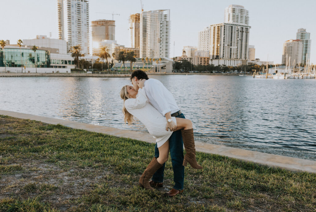 Couple dipping in front of St. Pete, FL skyline