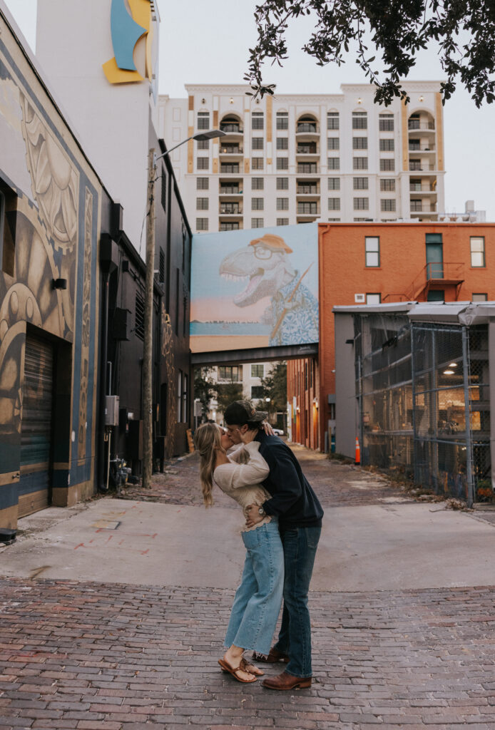 Couple posing with mural in downtown, St. Pete