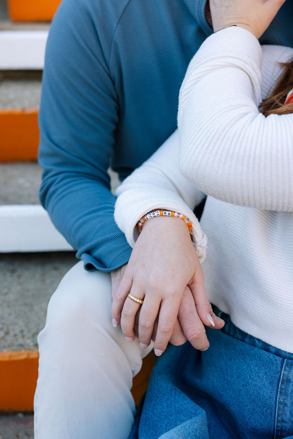 Close-up of engagement ring as couple sits together after Neyland Stadium proposal