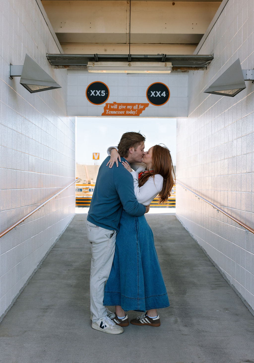 Couple kissing in Neyland Stadium tunnel after surprise proposal at University of Tennessee