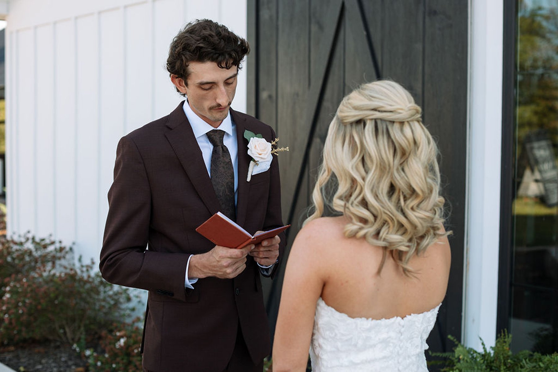 Tennessee wedding groom reading vows during private first look moment