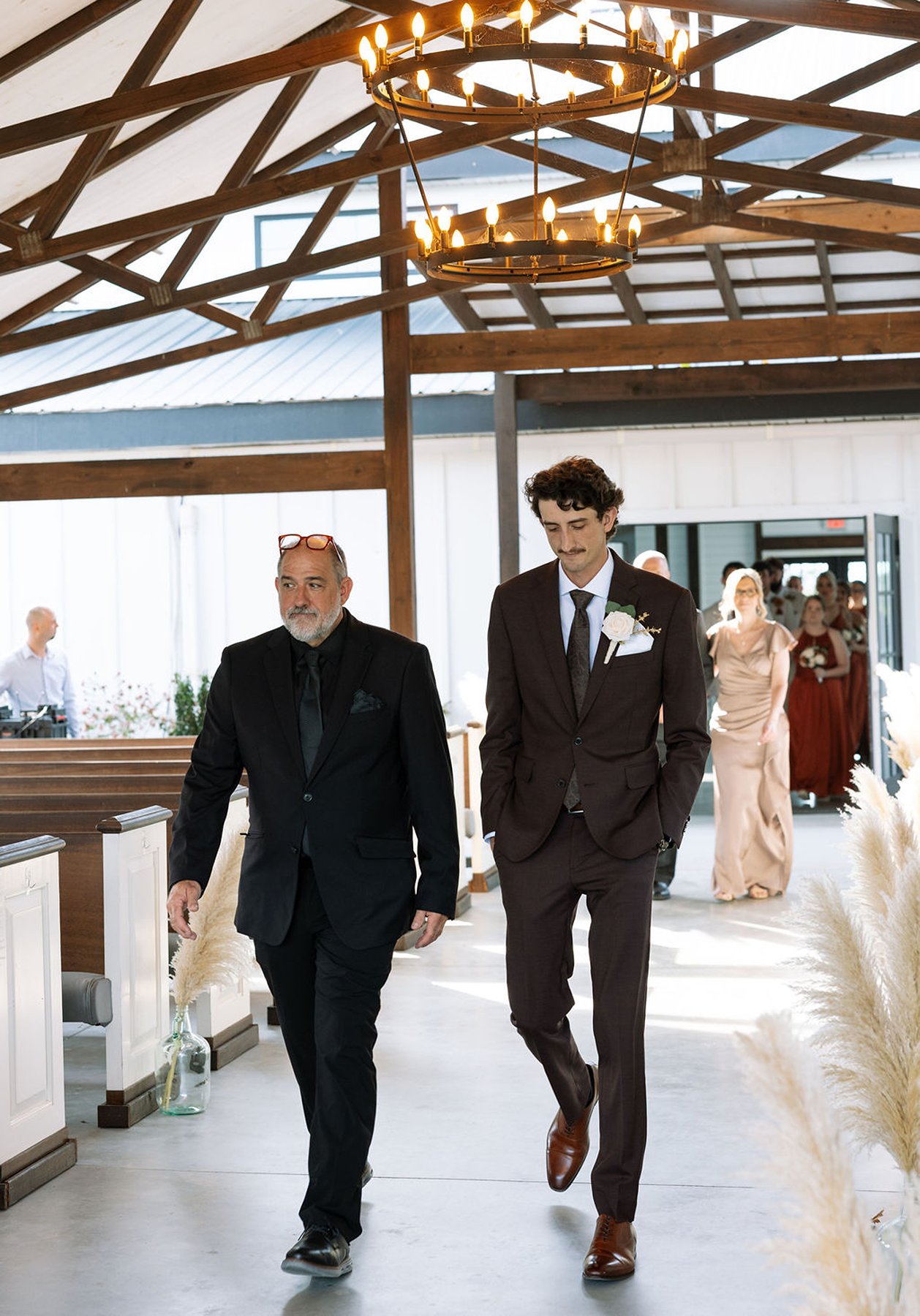 Tennessee wedding groom walking down aisle with officiant before ceremony