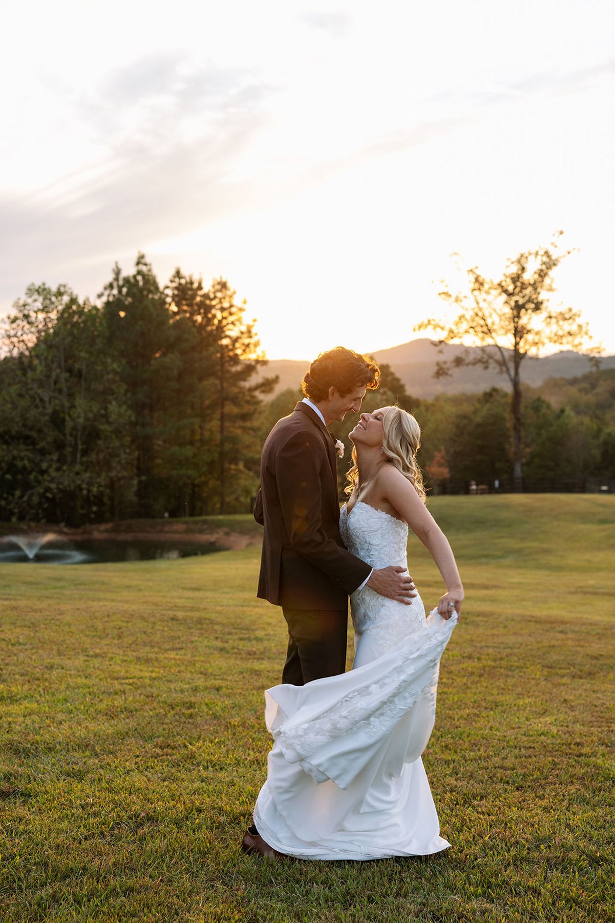 Tennessee wedding sunset portrait with bride and groom holding each other closely