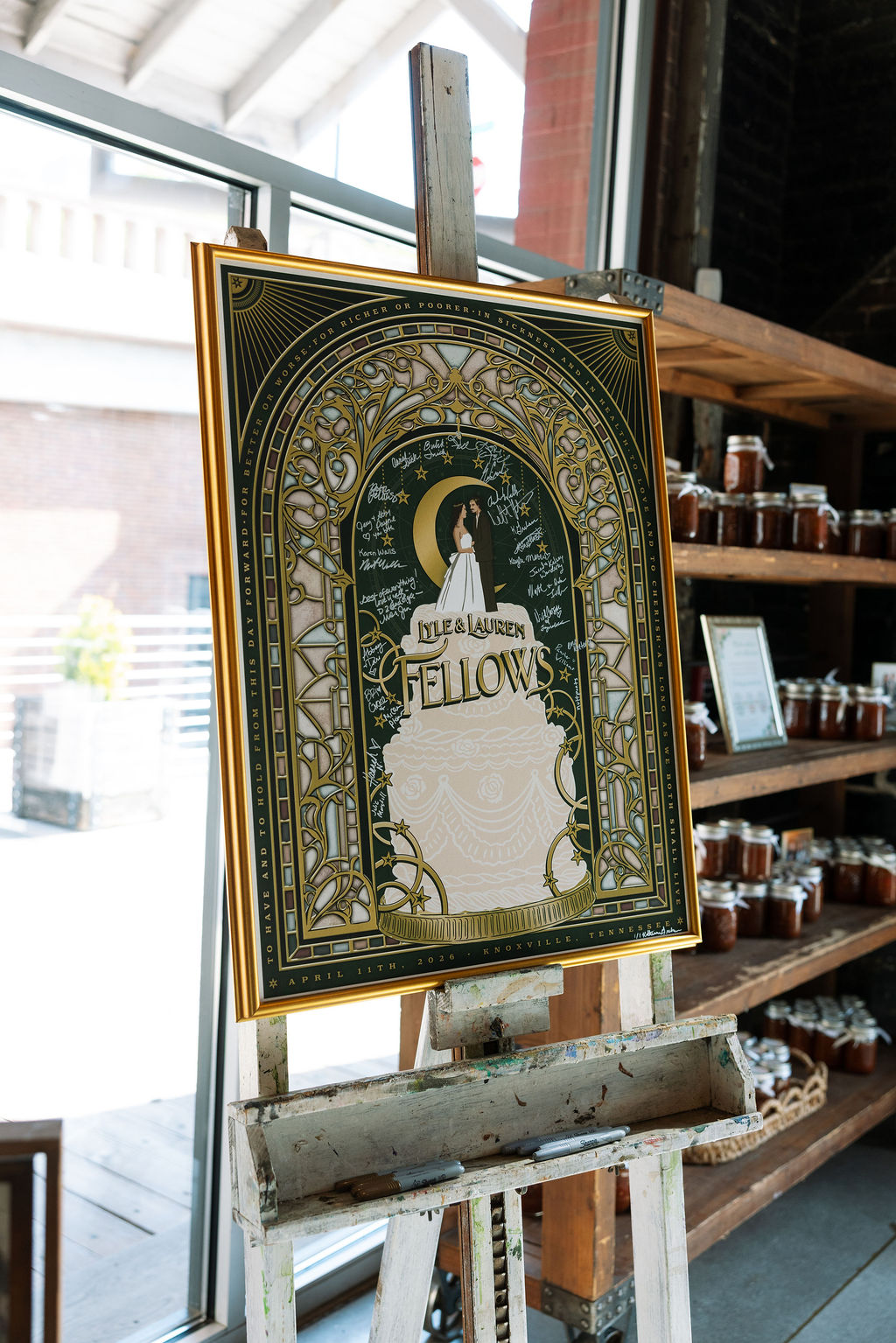Custom wedding welcome sign on easel with illustrated couple and gold detailing