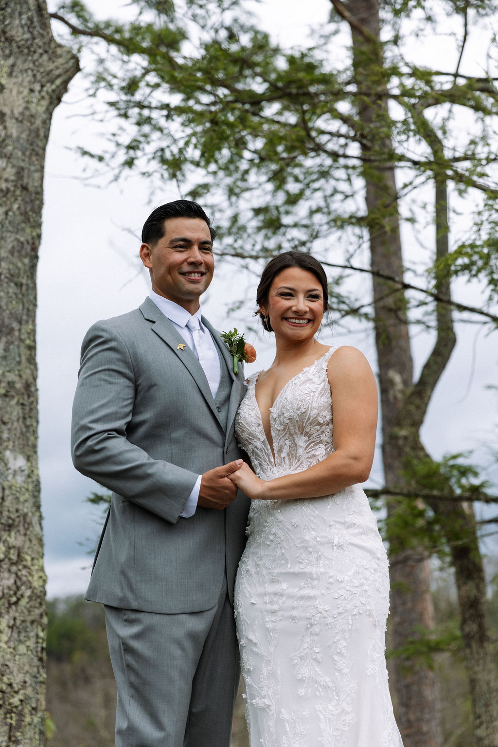 Bride and groom posing together during portraits in the mountains of East Tennessee
