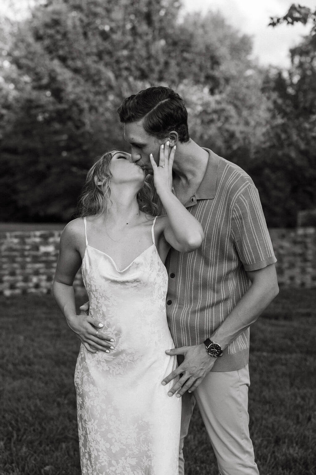 Black and white engagement portraits at Maple Grove Estate with intimate candid moments