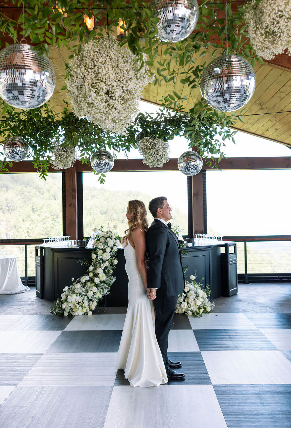 Bride and groom holding hands during first look inside a Knoxville wedding venue