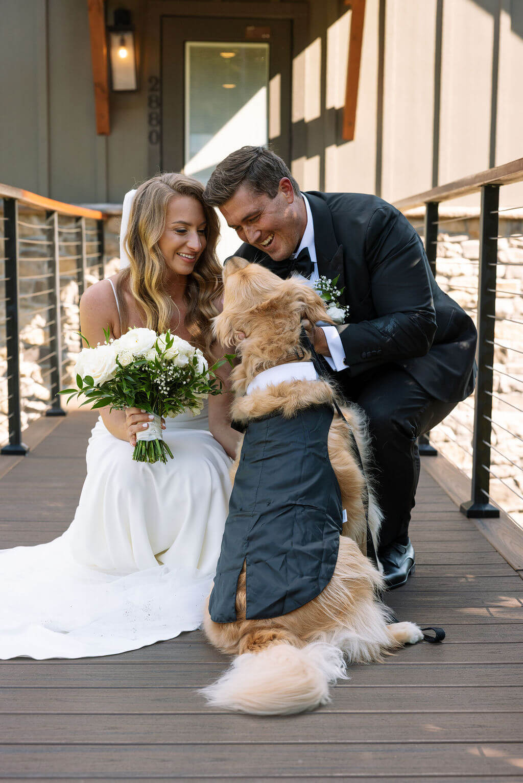Bride and groom with their dog after ceremony at a Knoxville wedding venue
