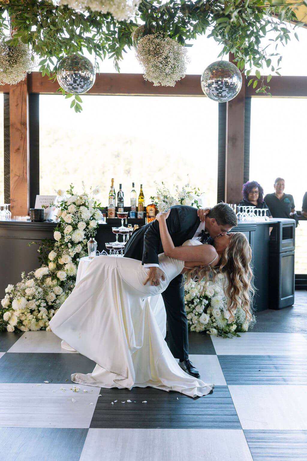Bride and groom dipping kiss during reception at a Knoxville wedding venue