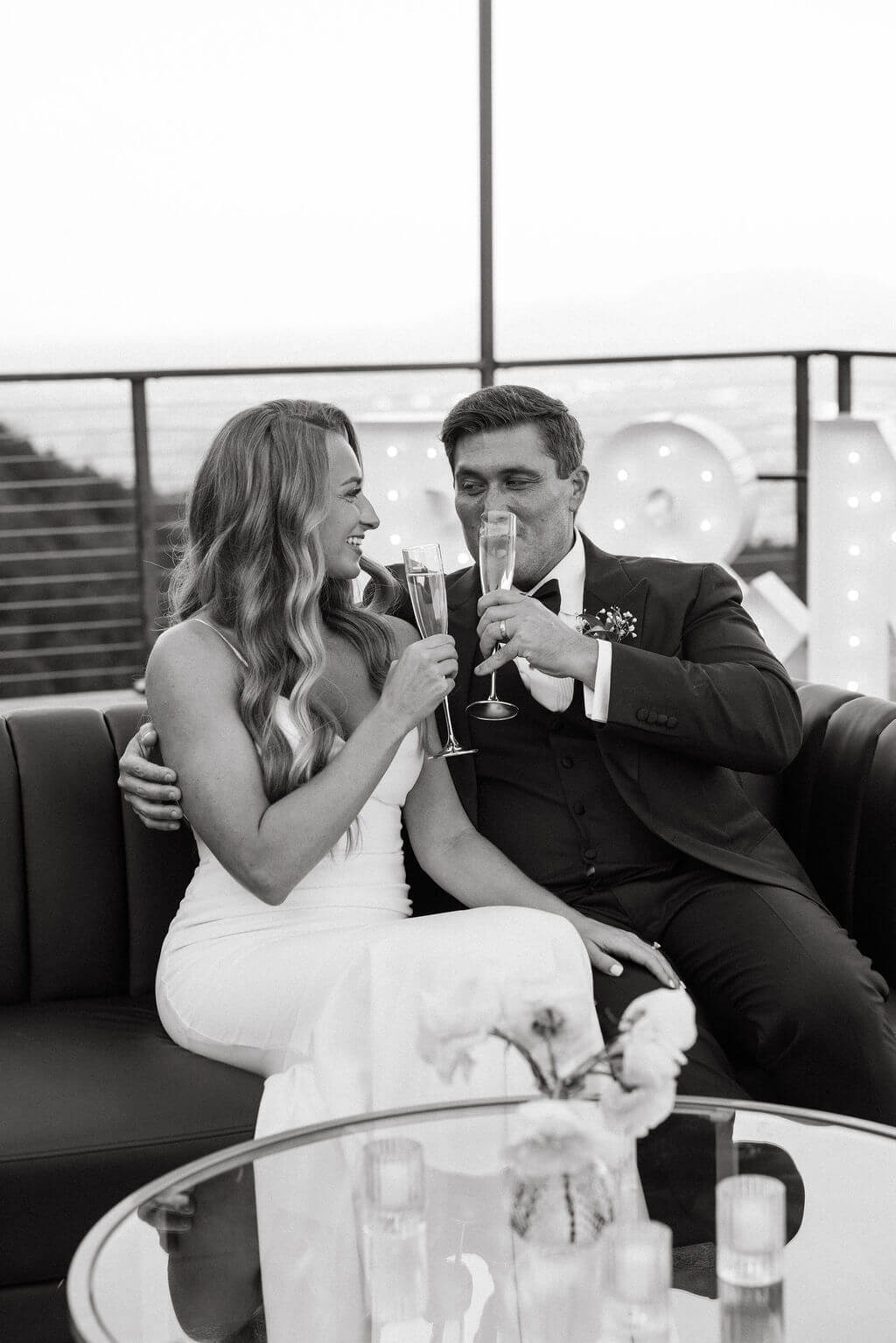 Bride and groom toasting champagne during wedding reception
