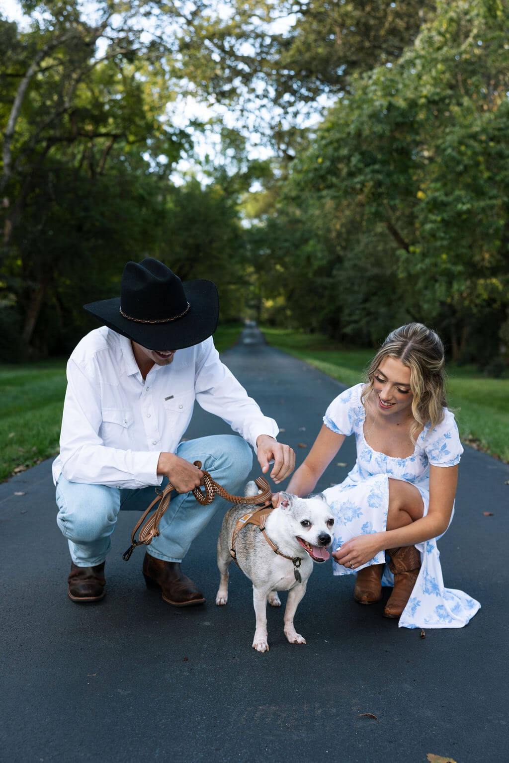 Couple with their dog during a relaxed engagement photoshoot at Maple Grove Estate