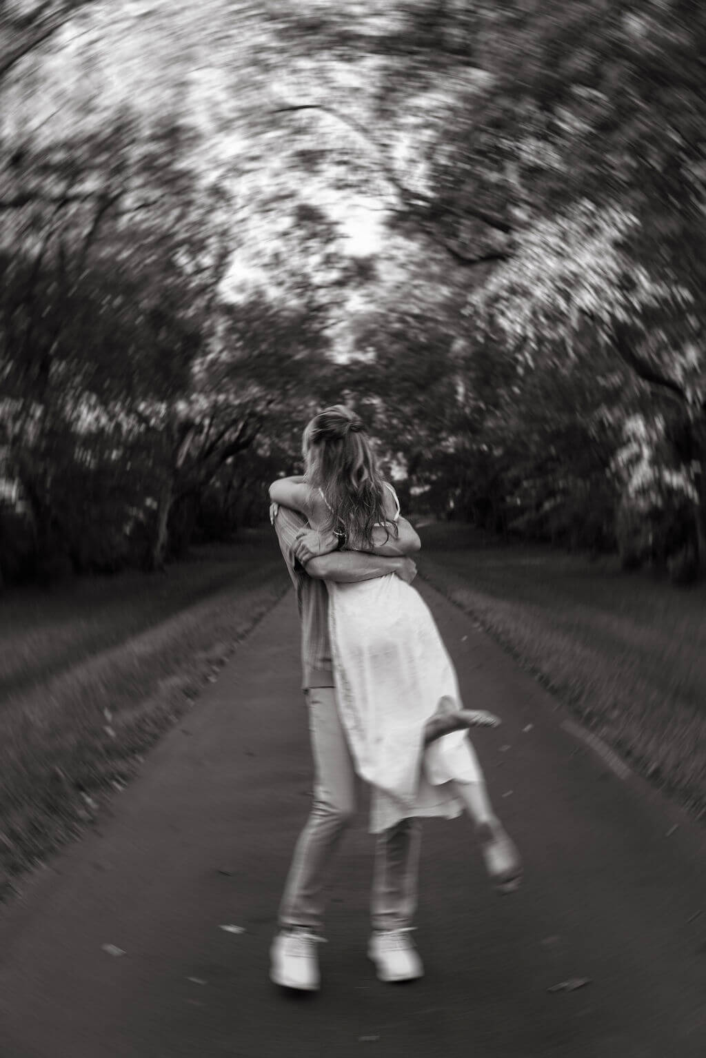 Black and white motion blur engagement photos at Maple Grove Estate
