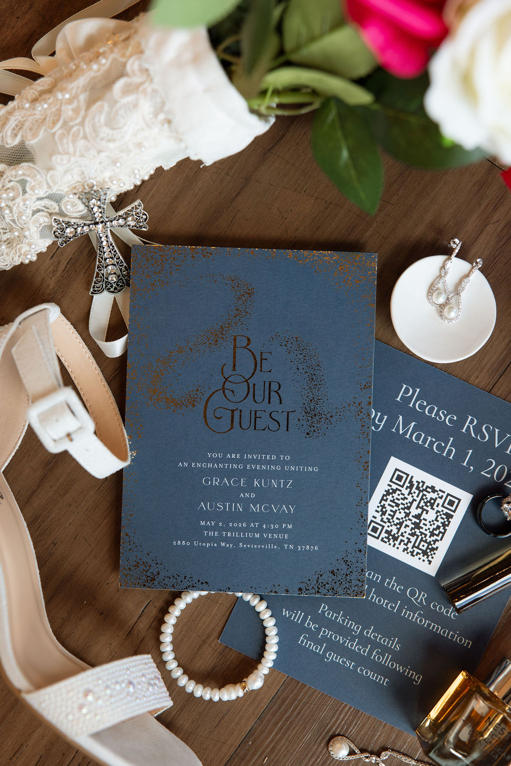 Flat lay wedding invitation suite with bridal accessories and florals for a mountain wedding in Tennessee