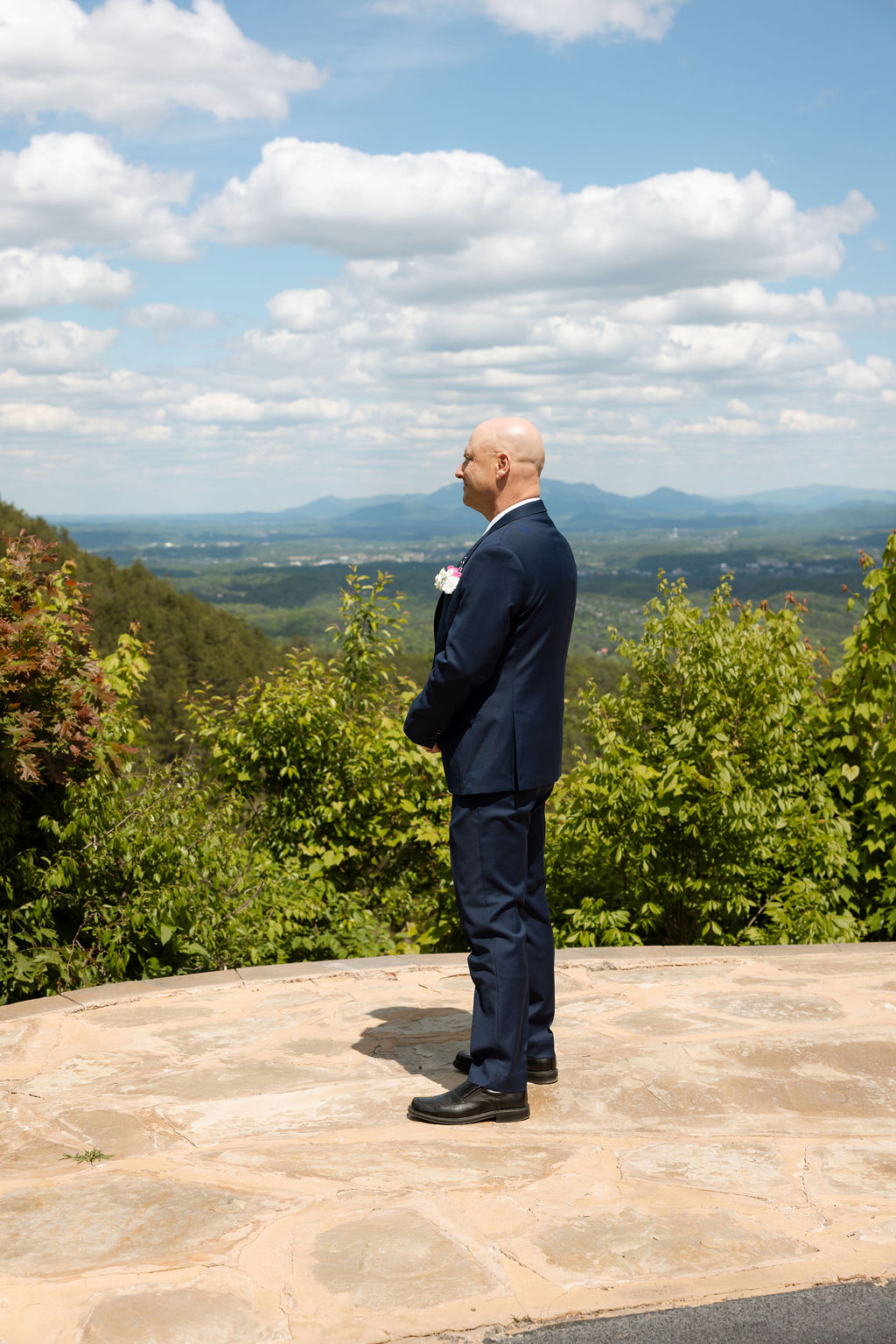 Father of the bride waiting during a first look with panoramic mountain views in Sevierville Tennessee