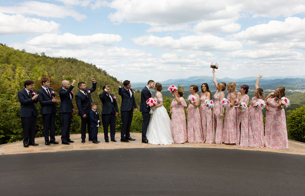 Wedding party celebrating with mountain views behind them at a Smoky Mountain wedding venue