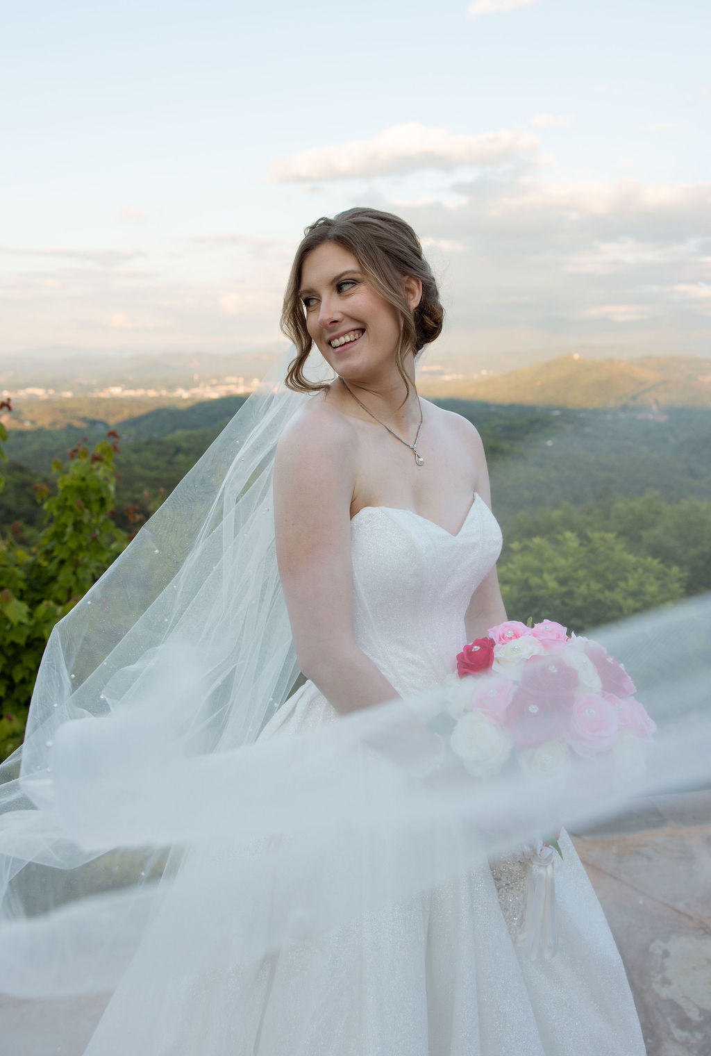 Bridal portrait with flowing veil and mountain views during a wedding day in Sevierville Tennessee