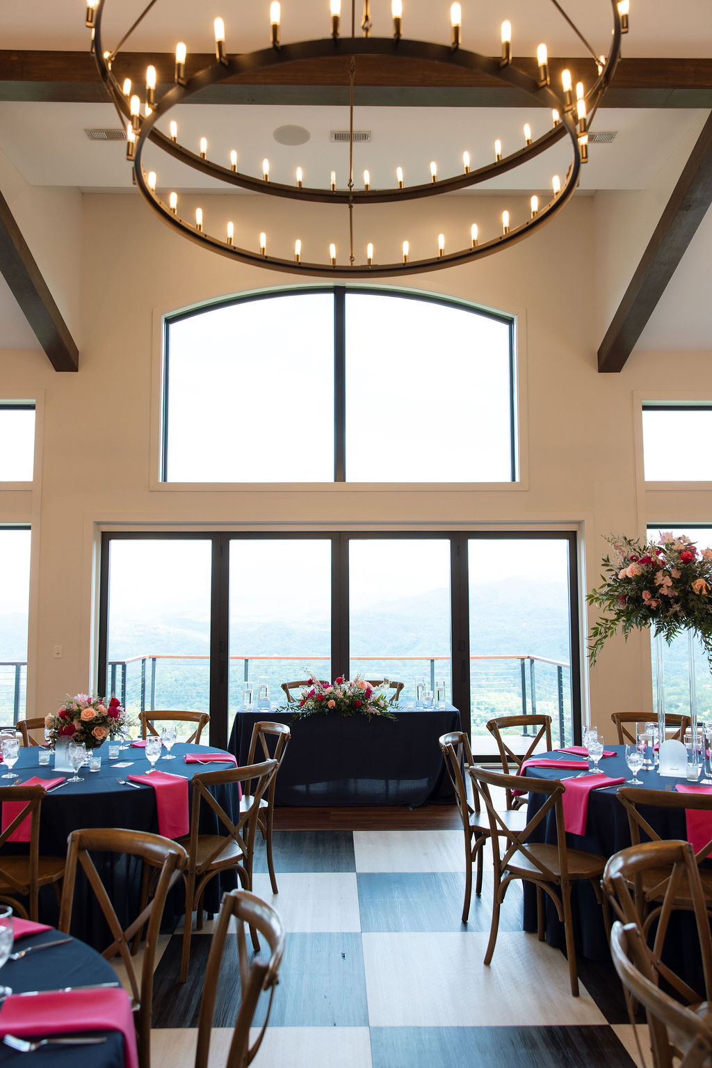 Elegant wedding reception space with mountain views and chandelier lighting at a Sevierville wedding venue