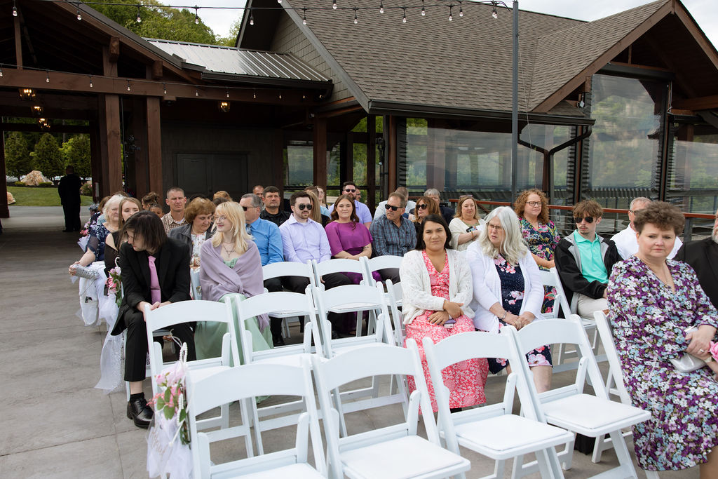 Wedding guests seated outdoors before the ceremony begins at a modern Sevierville wedding venue