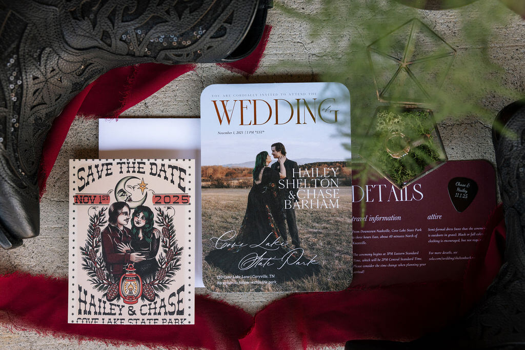 tattoo inspired invitation suite with invitations, save the dates, and wedding rings in a glass box.