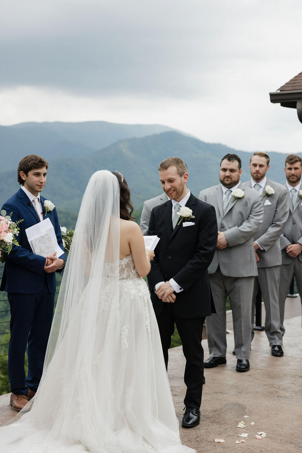 Bride and groom exchanging vows during their mountain-view wedding ceremony at The Magnolia.